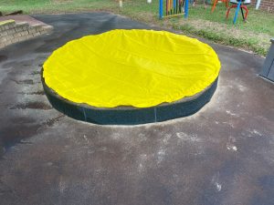 Sand Pit covered with Yellow Cover