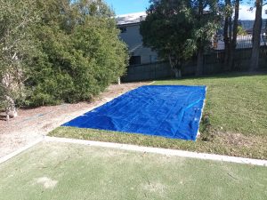 Sandpit Cover with weighted edges keeping the sand pit safe for children